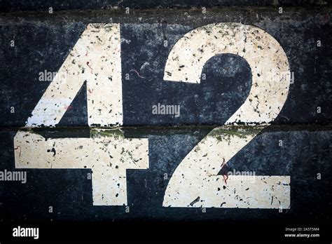 Number forty two in bold figures on black background Stock Photo - Alamy