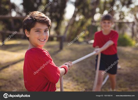 Kids practicing tug of war Stock Photo by ©Wavebreakmedia 155159216