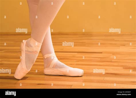 Woman pointing with ballet shoes Stock Photo - Alamy