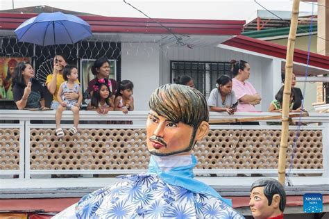 Papier-mache puppets paraded to celebrate Higantes Festival in ...