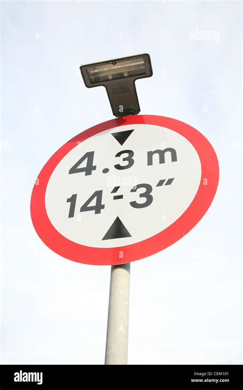 height limit sign warning of a low bridge Stock Photo - Alamy