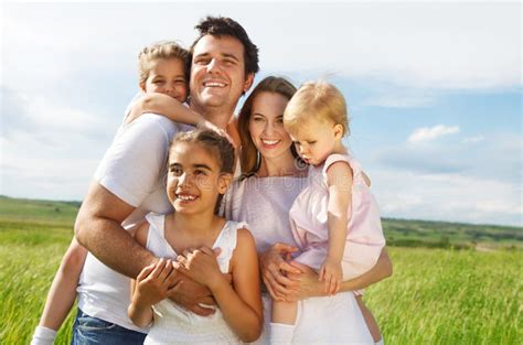 Happy Young Family With Three Children Stock Image - Image of outside, couple: 28925355