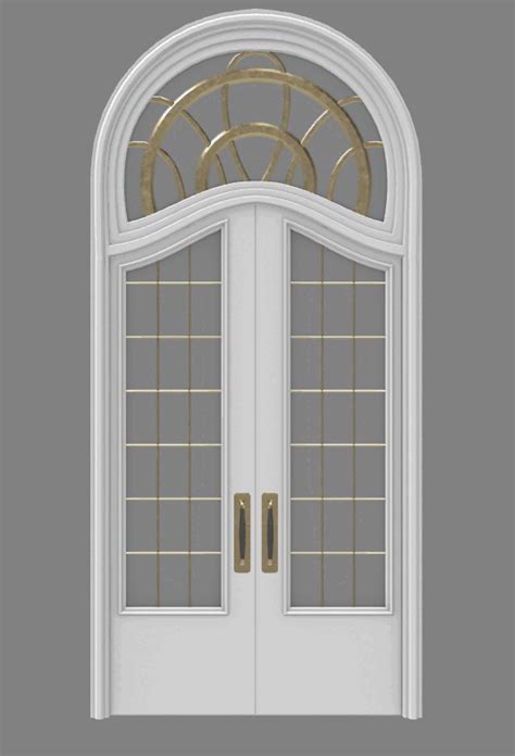 a white double door with arched glass and gold trim on the top part of it