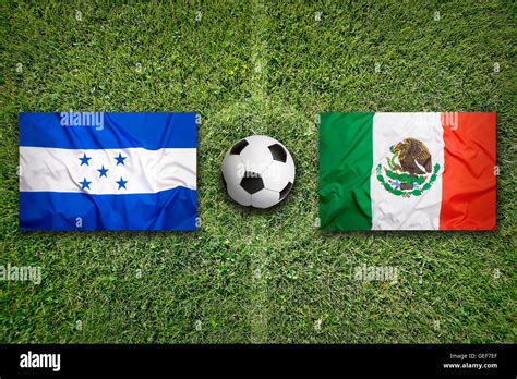 Honduras vs. Mexico flags on green soccer field Stock Photo - Alamy