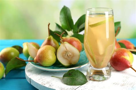 Premium Photo | Fresh pear juice with fruit on bright background