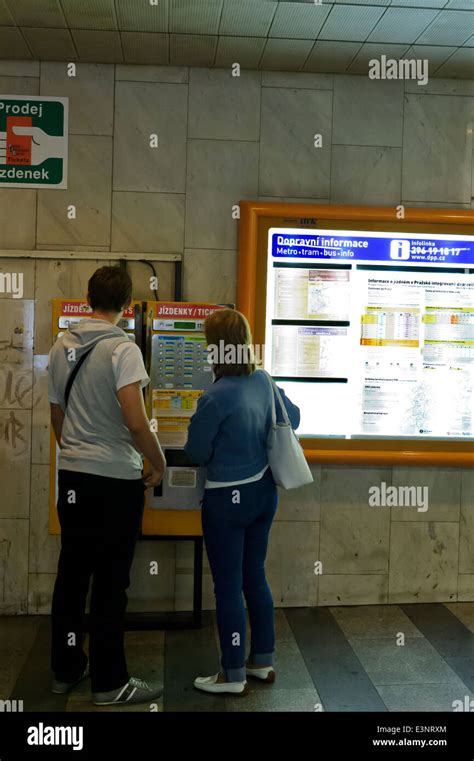 A couple buying Metro tickets from a ticket machine, Prague, Czech Republic Stock Photo - Alamy