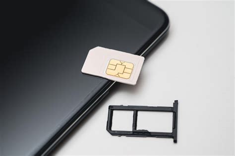 Premium Photo | SIM card replacement in the phone Mobile Simcard