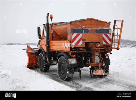 Mercedes Unimog snow plow in action, Affalterbach, Germany, Febr. 01, 2010 Stock Photo - Alamy