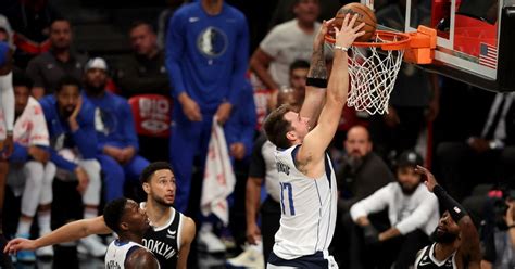 NBA roundup: Luka Doncic gets triple-double in Mavs' OT win | Reuters