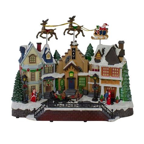 Northlight 11 in. H x 16 in. W LED Lighted and Animated Christmas Village with Flying Sleigh ...