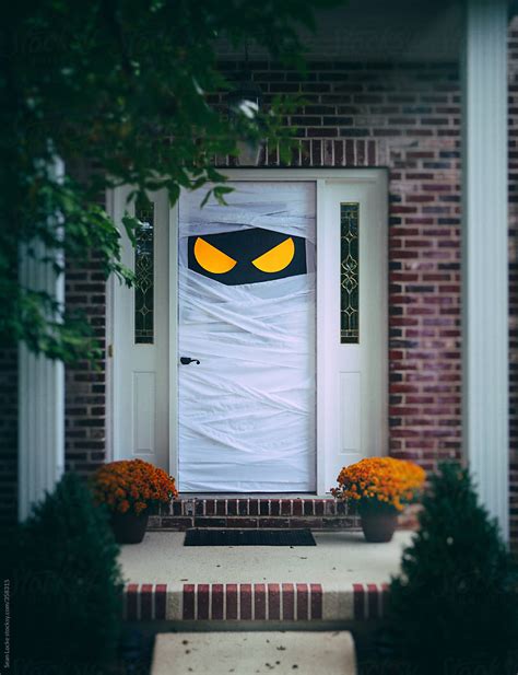 Spooky Halloween Door Wrapped Up As Mummy by Sean Locke - Halloween, Holiday - Stocksy United