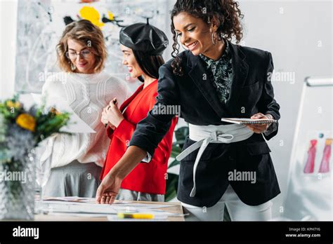 multiethnic fashion designers working together Stock Photo - Alamy