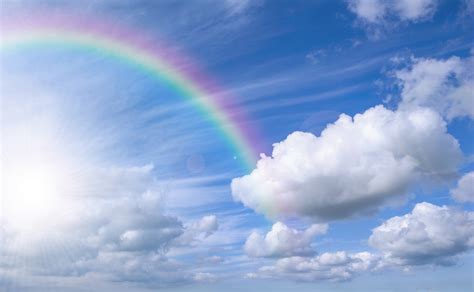 Rainbow over the blue sky