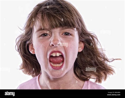 Young angry girl with mouth open yelling isolated on white background Stock Photo - Alamy