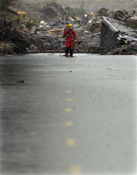 Community waits to hear full toll of mudslide