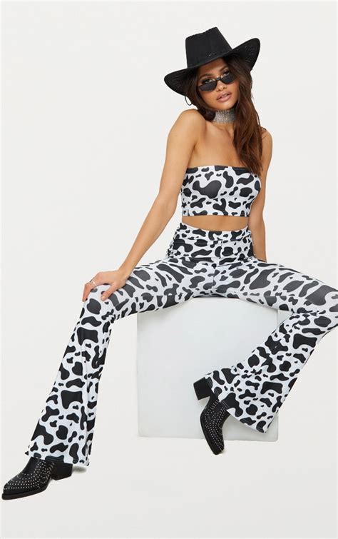 White Cow Print Slinky Flared Trousers | PrettyLittleThing