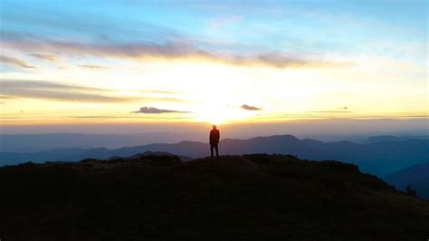 The happy man standing on the mountain on the sunrise background Stock Video Footage 00:10 SBV ...