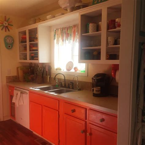 Sometimes you get a crazy idea to paint your kitchen cabinets orange ...