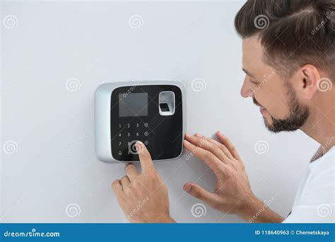 Male Technician Programming Alarm System Indoors Stock Image - Image of guard, digital: 118640963