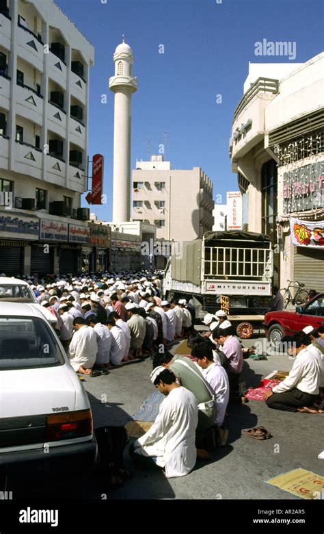 UAE Dubai Religion muslim worshippers praying in street outside Mosque ...