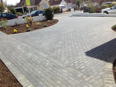 Charcoal block paving driveway finished with planting | Garden paving, Driveway paving, Garden slabs