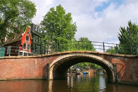 Small bridge over Amstel river in Amsterdam, Netherlands (Holland ...