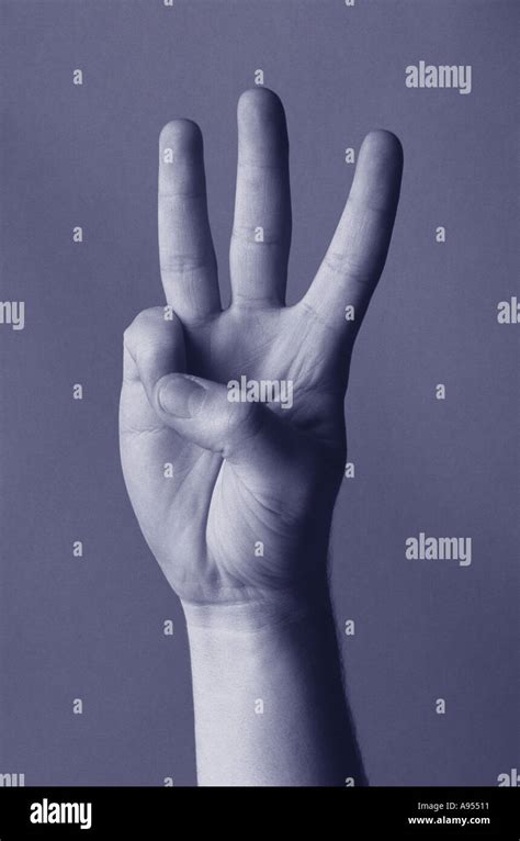 Hand showing three fingers Stock Photo - Alamy