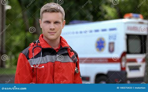 Male Paramedic Posing for Camera, Ambulance on Background, Professionalism Stock Image - Image ...