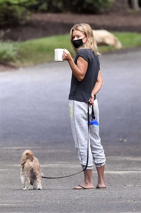 Kelly Ripa in a Black Tee Walks Her Dog Out with Her Husband Mark ...