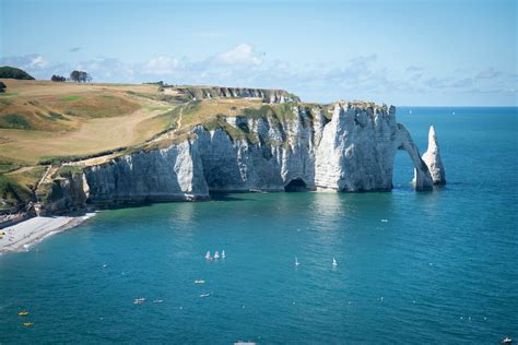 Visit Étretat's Striking White Chalk Cliffs and Magnificent Rock Arch | TravelAwaits