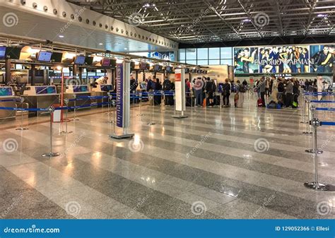 Passengers Lined Up For Chek-in Inside The Milan-Malpensa Airport Terminal 1. Editorial Image ...