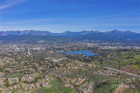 Aerial view of Puddingstone Reservoir with Mt. Baldy as backgrou ...