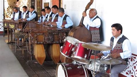 HISTORY. This is a picture of a Guatemalan band. The music is based off a marimba which is the ...