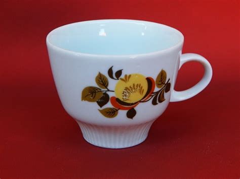 Vintage Porcelain Coffee Cup With Floral Design On The Red Background ...