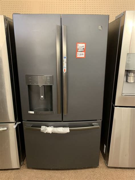 Brand new scratch and dent GE 27.8 cu. ft French door refrigerator with door-indoor Black Slate ...