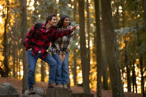 Premium Photo | Smiley people exploring nature full shot