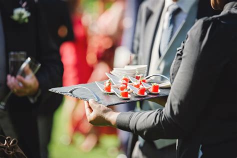 woman, wearing, black, suit jacket, holding, tray, hands holding plate ...