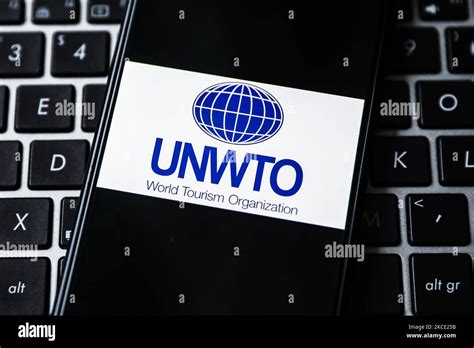 United Nations World Tourism Organization logo is displayed on a mobile phone screen ...