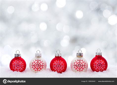 Red and white Christmas ornaments with twinkling background Stock Photo ...