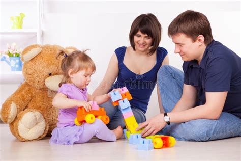 Happy Parents Playing with Child at Home Stock Image - Image of ...