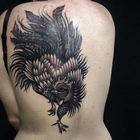 Black rooster tattoo on back - Tattooimages.biz