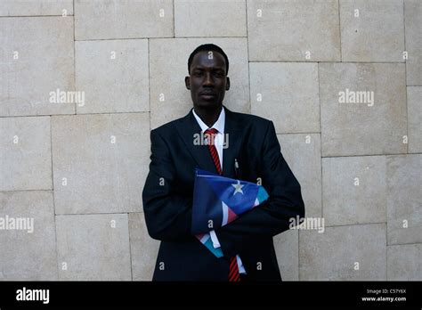 South Sudanese man holds the flag of Republic of South Sudan during independence celebrations ...