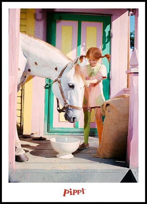 Photograph of Pippi Longstocking and her horse standing on the porch of the colorful Villa ...