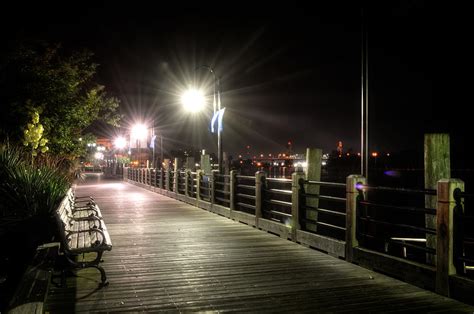 Wilmington Riverwalk At Night Photograph by Greg and Chrystal Mimbs - Fine Art America