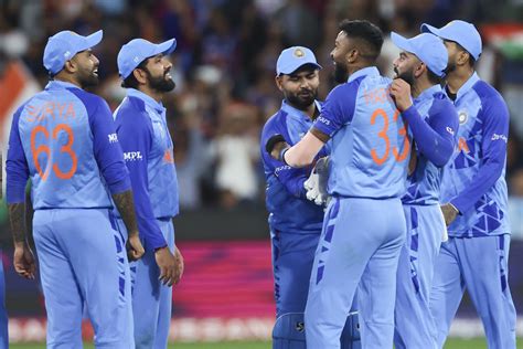 Hardik Pandya is congratulated by team-mates after taking a wicket ...