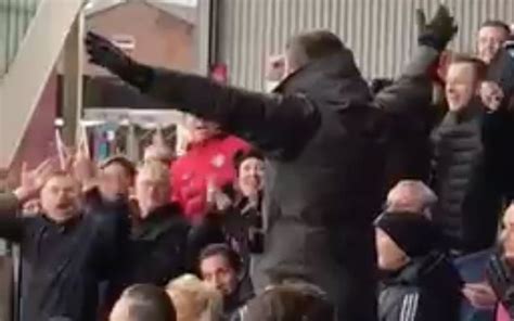 Video: Manchester United star leads chants and sits with fans