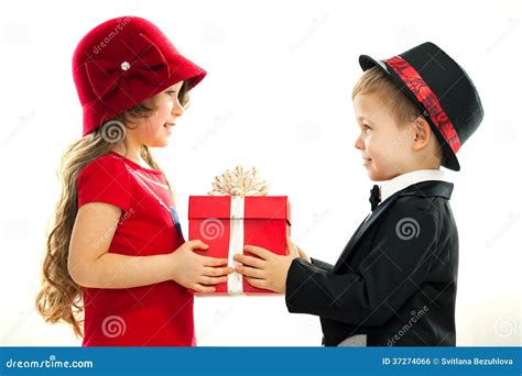 Little Boy Giving Girl Gift Stock Photo - Image: 37274066