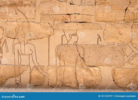 Ancient Hieroglyphs and Relief Engravings Carved into a Stone Wall at ...