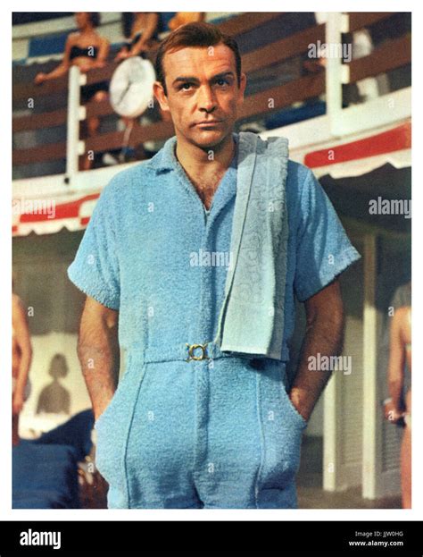 James Bond 'Goldfinger' (Sean Connery) in a blue poolside towelling ...