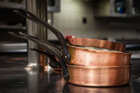 three, brass, colored, cooking pans, household equipment, indoors, focus on foreground, kitchen ...